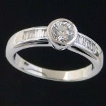 Collet set brilliant diamond ring, 0.47ct, on baguette shoulders, in 18k (750) white gold, ring size