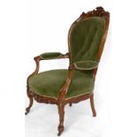 Victorian walnut carved show frame open arm chair on French cabriole legs.