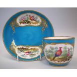 Sevres cup and saucer, painted with exotic birds within gilded cartouches on a blue ground,