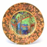 Wedgwood Fairyland lustre plate, decorated with Imps on Bridge pattern within floral border, 27cm