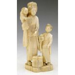 Japanese carved ivory sectional figure group of a woman with two children and a basket, Meiji -