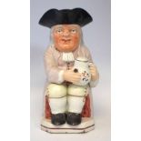 Staffordshire Ralph Wood type toby jug, typically modelled with pipe and ale jug, of the earlier