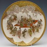 Satsuma dish painted with dancers and musicians, late Meiji period, signed on base, diameter 22cm.