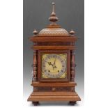 Quarter striking table clock c.1890, the Pagoda top with turned finials side sound fret doors, 7"