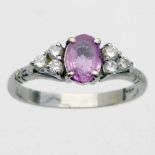 750 white gold ring set with an oval pink sapphire and six small diamonds, ring size P, gross weight