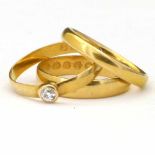 Three 22ct gold wedding rings, one dressed with a diamond, gross weight 7.7g (3)