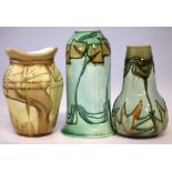 Three Minton Secessionist ware vases, tube lined with foliate patterns on yellow, green and blue