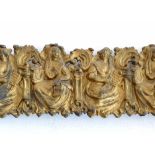 Gilt pressed brass pelmet of a repeating pattern of the Muses of literature and music, height