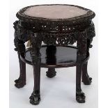 Chinese Qing carved hardwood foliate table, the inset red marble top over a uniting lower shelf,