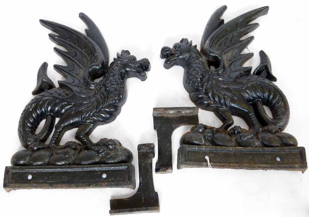 Pair of cast iron griffins, flat backed, height 70cm, together with a pair of brackets