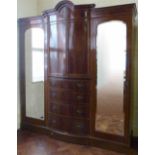 Edwardian inlaid mahogany wardrobe, the bowed central section flanked by mirrored doors, length