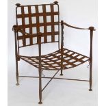 Steel strapwork elbow chair.