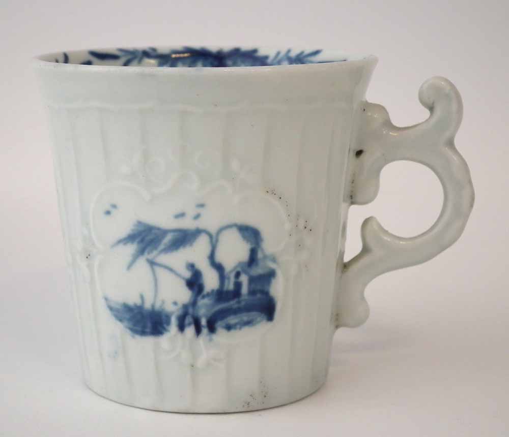 Worcester cup circa 1760, with panel moulded body, double scroll handle, painted with a figure