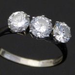 Three-stone diamond ring set in 18ct white gold (Birmingham date letter rubbed), round brilliant cut