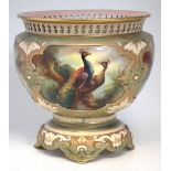 Royal Worcester Hadley's ware jardinière, signed H. Martin, decorated with peacock, with pierced