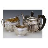 Scottish silver three-piece tea set, Wilson & Sharp, Edinburgh 1906, each with an oval fluted