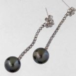 Pair of black pearl, 11mm, and diamond pendant earrings, indicated D057, in K18 white gold, length