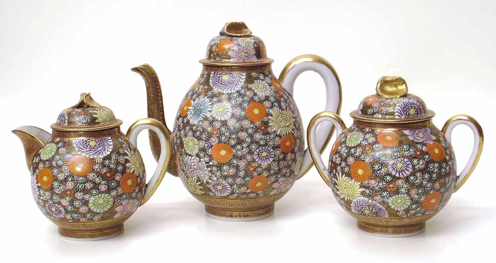 Japanese Kutani eggshell porcelain three piece tea set with all-over floral decoration, Kutani mark