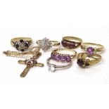 Six 9ct gold dress rings and a German garnet set ring, also a pendant cross. Condition report: see