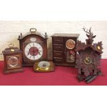 Cuckoo clock and three mantel clocks and barometers. Condition report: see terms and conditions