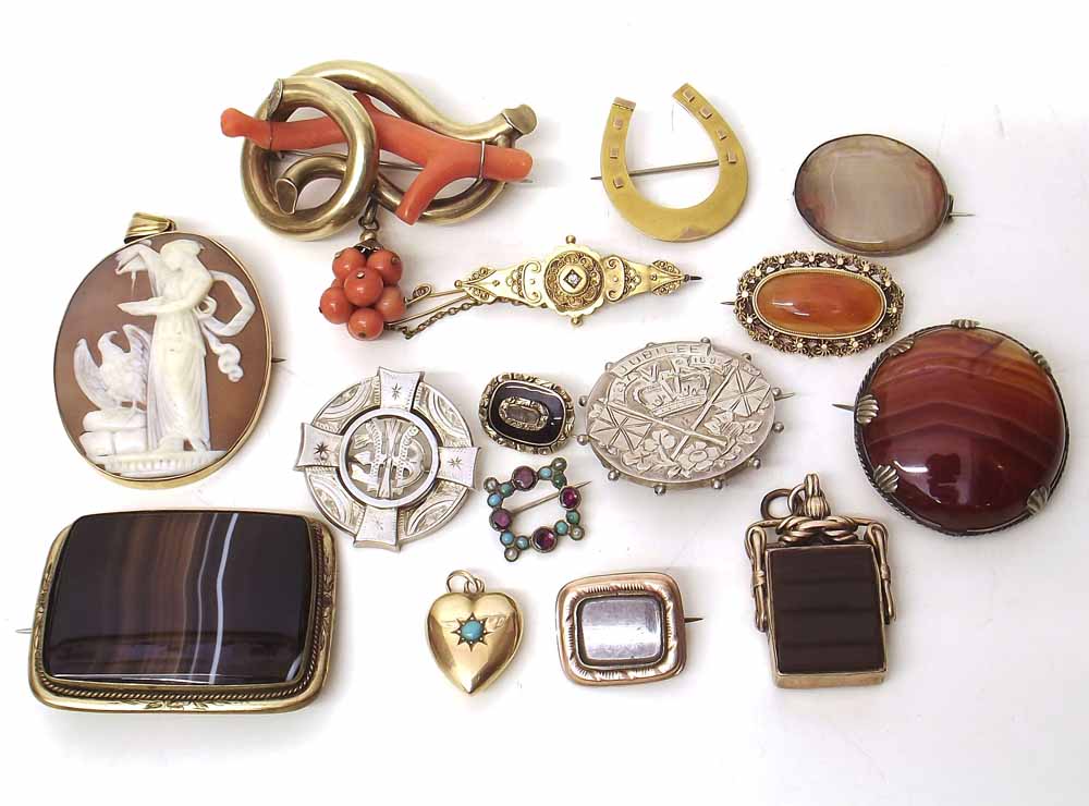 Victorian red coral and gilt metal brooch, four banded agate brooches, 9ct gold horseshoe brooch,