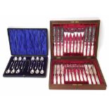 Cased set of twelve silver teaspoons and sugar nips, also a cased set of dessert knives and forks