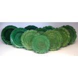 Seven Brameld leaf moulded plates, decorated with overall green glazes, also two similar Wedgwood