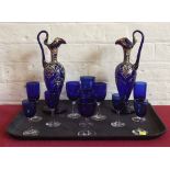 Pair of Coblat blue overlaid jugs and eleven Cobalt blue glasses. Condition report: see terms and