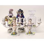 Pair of continental figures, pair of candlestick figures and a glass decanter. Condition report: see