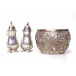 Pair of hammered silver pepper pots and a bowl decorated with repuse work. Condition report: see