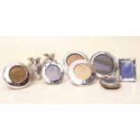 Seven small silver photograph frames and a pair of small silver vases. Condition report: see terms