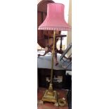 Brass adjustable standard lamp with complete with pink shade Condition report: see terms and