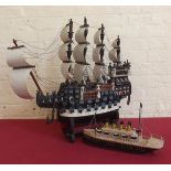 Modern tin plate model of the Titanic and wooden model of a 3 masted galleon Condition report: see