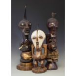 Three Songye Nkisi power figures, the tallest measures 47cm high All lots in this Tribal and African