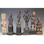 Six African figures carved in various tribal styles, the tallest measures 26cm high All lots in this