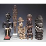 Ngbaka mother and child figure, Yoruba seated figure, Sapi figure and two other African figures, the