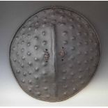 Ethiopian hide shield, 67cm diameter All lots in this Tribal and African Art Sale are sold subject