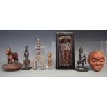 Collection of items carved in various tribal styles, to include a heddle pulley, small figure, comb,