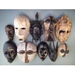 Ten masks carved in various tribal styles, the largest measures 31cm high All lots in this Tribal