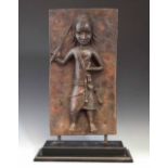 Benin bronze plaque of a warrior, 51cm high excluding wood base. All lots in this Tribal and African