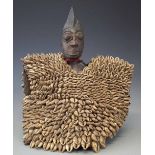 Yoruba Ibeji figure, with large cowrie shell jacket, 35cm high All lots in this Tribal and African