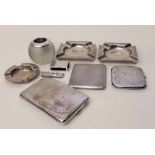 Pair of silver ashtrays, three silver cigarette cases, match ball, cigar cutter, ashtray, matchbox