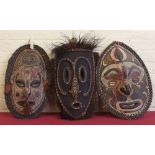 Three Papua New Guinea Sepik River masks the largest measures 56cm high Condition report: see