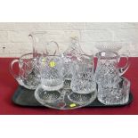 Cut glass basket, three jugs, two mugs, bottle coaster, two bowls and a serving dish. Condition