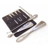 Silver handled manicure set, two shoe horns, two button hooks. Condition report: see terms and