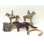 Pair of brass horse and rider door stops, copper horse hoof, iron 'Tally Ho' money bank and a dog