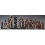 Twelve African figures, carved in various tribal styles, the tallest measures 20cm high All lots