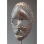 Dan Gunyege racing mask, 20cm high All lots in this Tribal and African Art Sale are sold subject