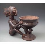 Luba bowl carved with a female figure, 41cm high All lots in this Tribal and African Art Sale are