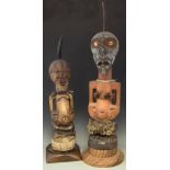 Two Songye Nkisi Power figures or Fetishes, the largest measures 104cm overall height. All lots in